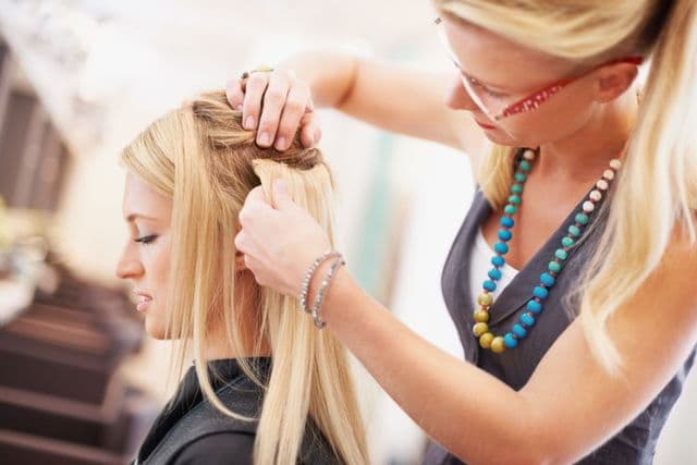 Service worker smiling while talking on phone